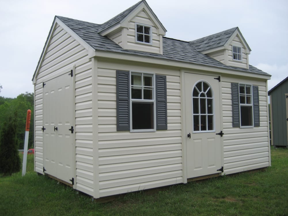 Double Dormer A-Frame storage shed with vinyl siding and arched glass 
