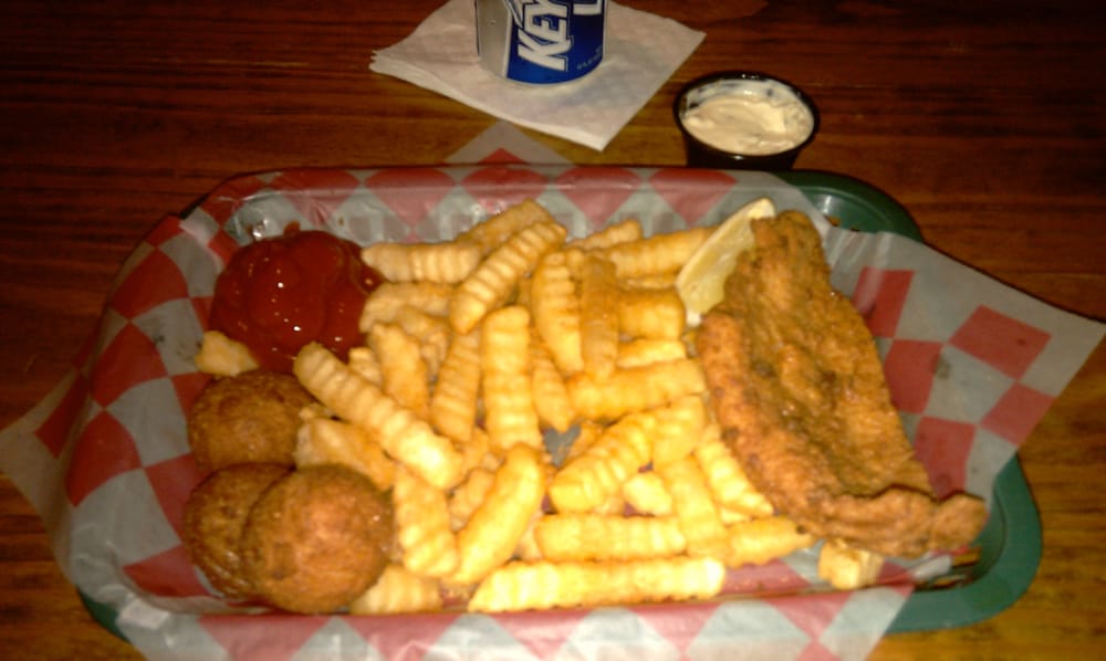 Fried catfish basket with hush puppies and fries. Yelp